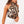 Vrouw draagt mouwloze blouse met luipaardprint en hoge hals, gecombineerd met witte rok. Modieuze dameskleding, trendy zomeroutfit.