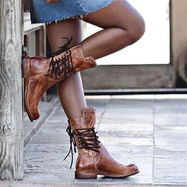 Bruine leren veterlaarzen voor dames, stijlvolle enkellaarzen met stevige zool, perfect voor casual herfst- en wintermode.