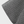 Grijze gewatteerde stof met vierkant patroon, close-up. Ideaal voor interieurdecoratie, textielprojecten en moderne woonaccessoires.