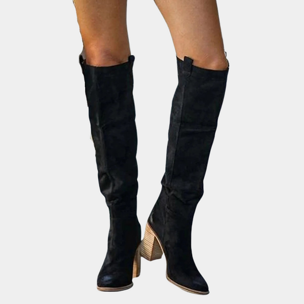 Zwarte suède dameslaarzen met hoge hak, knielengte, modieus design. Perfect voor herfst- en wintermode. Comfortabele en stijlvolle laarzen.