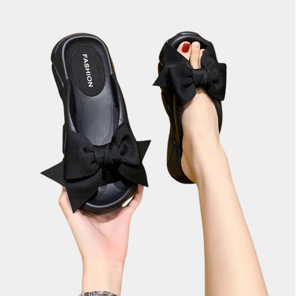 Zwarte sandalen met grote strik, modieuze dames slippers, comfortabele zomerschoenen, trendy design, perfect voor casual en elegante outfits.
