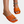 Oranje dames sandalen met gevlochten bandjes en open teen, gedragen met enkelbandje. Perfect voor zomerse outfits en stranddagen.