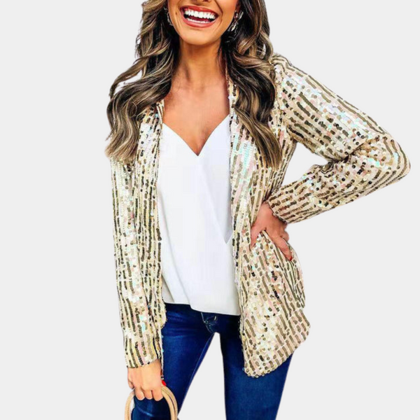 Gouden pailletten blazer voor dames, gecombineerd met witte top en blauwe jeans. Perfect voor feestelijke gelegenheden en modieuze outfits.