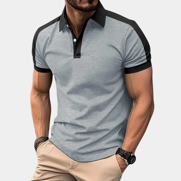 Grijze herenpolo met zwarte accenten, korte mouwen en kraag. Modieuze casual stijl, ideaal voor dagelijks gebruik. Comfortabele pasvorm.