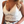 Witte kanten crop top met bloemenpatroon, gedragen door vrouw. Trendy zomermode, perfect voor casual en feestelijke gelegenheden.