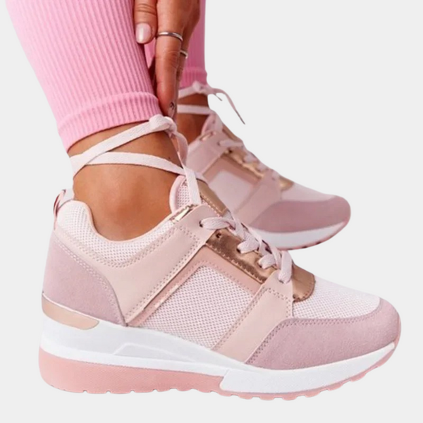 Roze dames sneakers met witte zool, mesh en suède details. Modieuze sportschoenen, perfect voor casual en sportieve outfits.
