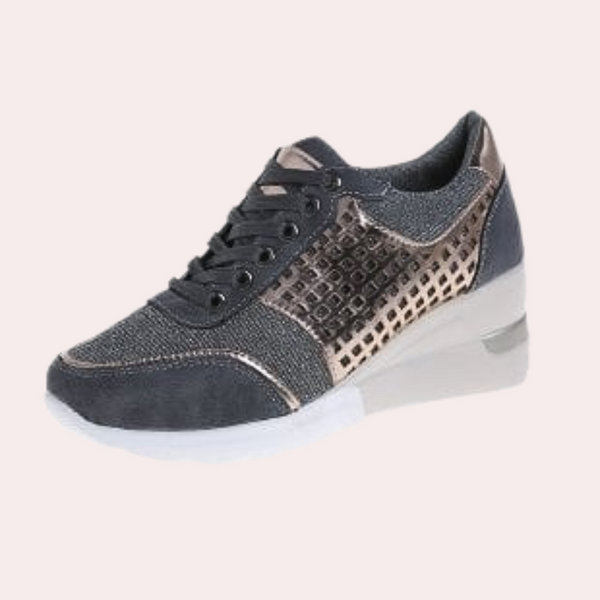 Grijze damessneaker met metallic accenten, comfortabele zool en vetersluiting. Modieuze en veelzijdige schoenen voor dagelijks gebruik.