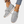 Grijze dames sneakers met veters, gebreid bovenwerk en witte zool. Modieuze casual schoenen, ideaal voor dagelijks gebruik en comfort.