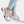Dames sneakers met luipaardprint zool, grijze en zilveren accenten, comfortabele pasvorm. Trendy sportschoenen voor dagelijks gebruik.