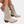 Beige suède cowboylaarzen met perforaties, lage hak en ritssluiting, damesmode, trendy schoenen, casual stijl.