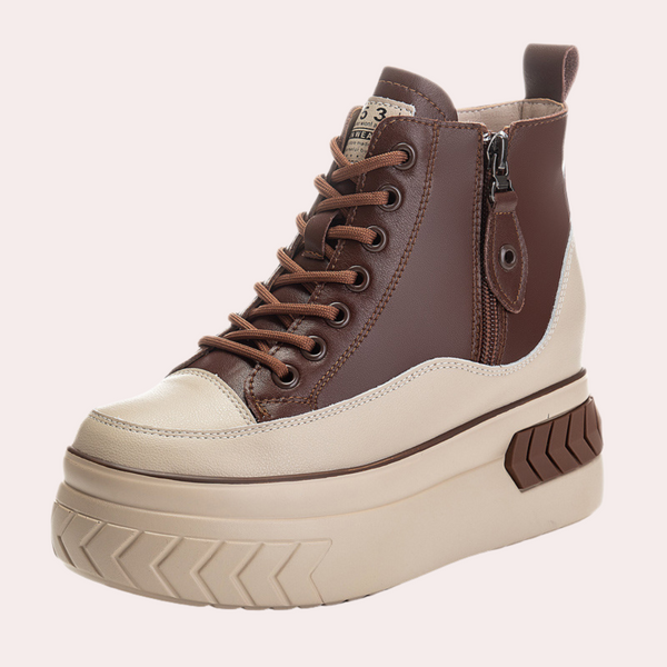 Bruine en beige damessneaker met dikke zool, ritssluiting en veters. Modieuze platform sneaker voor casual en trendy outfits.