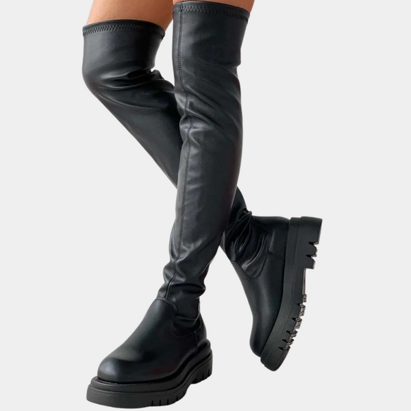 Zwarte overknee laarzen voor dames, gemaakt van leer met dikke zool. Trendy en stijlvol schoeisel voor herfst en wintermode.