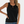 Zwarte mouwloze dames top met ronde hals en decoratieve uitsnede, perfect voor casual en formele gelegenheden. Stijlvolle en veelzijdige mode.