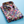 Opgevouwen herenoverhemd met kleurrijke bloemenprint op blauwe achtergrond, ideaal voor modieuze casual outfits. Bloemenoverhemd, herenmode.