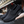 Zwarte dames sneakers met ademend mesh, slip-on design en verhoogde zool. Comfortabele schoenen voor dagelijks gebruik en wandelen.