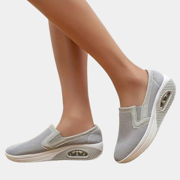 Grijze dames slip-on sneakers met luchtkussen zool, ademend mesh bovenwerk, comfortabele casual schoenen voor dagelijks gebruik.