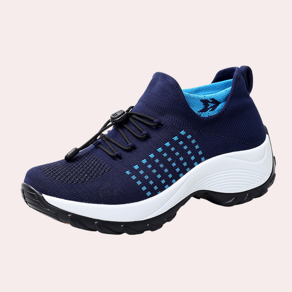 Blauwe sportschoen met elastische veters, ademend mesh bovenwerk en stevige witte zool. Ideaal voor hardlopen en fitness. Unisex design.