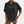 Zwarte damesblouse met korte mouwen, knoopsluiting en borstzakken, gecombineerd met denim shorts. Casual en stijlvolle damesmode.
