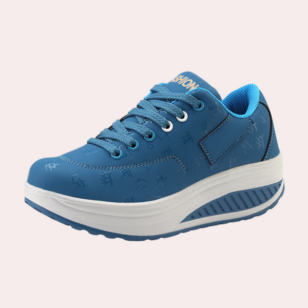 Blauwe damessneaker met verhoogde zool, comfortabele pasvorm en modieuze details. Perfect voor dagelijks gebruik en casual outfits.