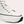 Witte leren sneaker met hoge zool, zwarte accenten en veters. Modieuze dames sneaker, comfortabel en stijlvol. Perfect voor casual outfits.