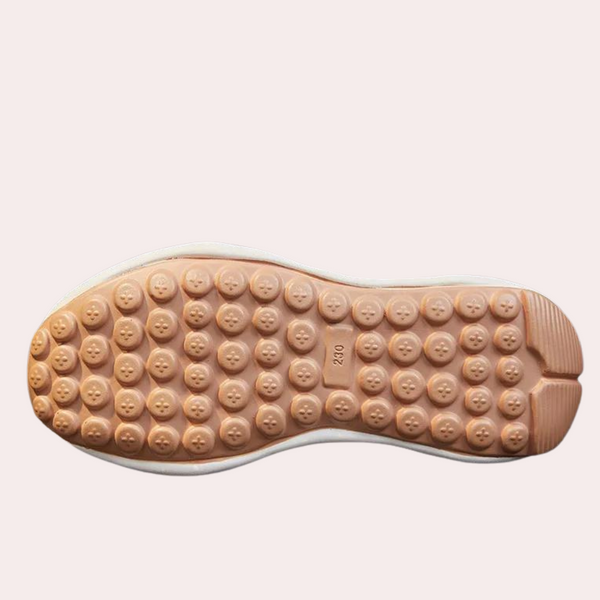 Roze rubberen schoenzool met ronde noppen, antislip ontwerp, detailweergave. Ideaal voor sportschoenen, biedt grip en stabiliteit.