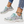 Dames sneakers met bloemenprint, witte zool en turquoise veters. Modieuze sportschoenen, ideaal voor casual en sportieve outfits.