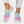 Roze en witte sneakers met regenboogpatroon, gedragen met witte gescheurde jeans. Trendy damesmode, comfortabele sportschoenen.