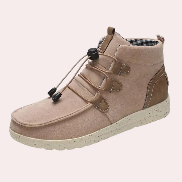 Beige suède herenschoen met elastische veters, comfortabele zool en bruine accenten. Stijlvolle en casual enkellaars voor dagelijks gebruik.