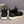 Zwarte suède herensneakers met witte zool, vetersluiting en geruite binnenvoering. Stijlvolle casual schoenen voor dagelijks gebruik.