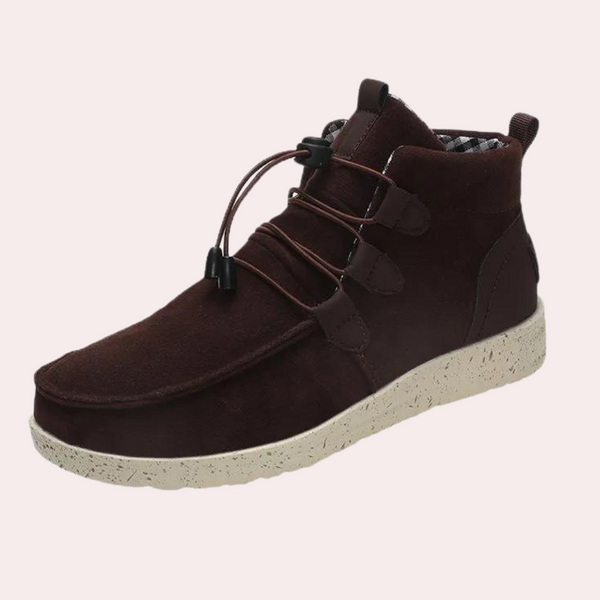 Bruine suède herenschoen met witte rubberen zool en elastische veters. Comfortabele en stijlvolle casual schoen voor dagelijks gebruik.