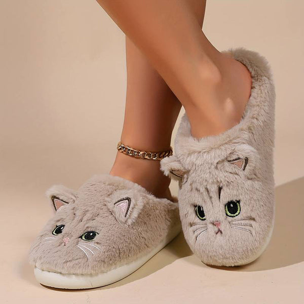 Pluche kattenpantoffels met schattig kattengezicht, zachte grijze stof, comfortabele binnenzool. Perfect voor warme voeten thuis.