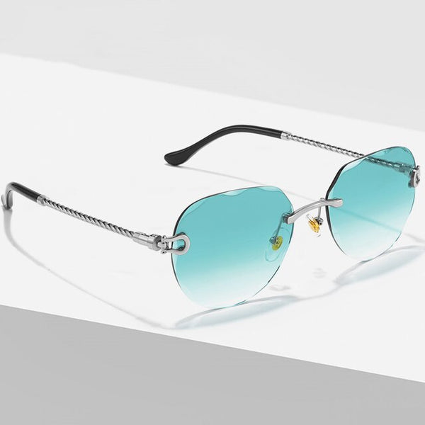 Randloze zonnebril met blauw-gradiënt lenzen en metalen frame, luxe design voor mannen en vrouwen. Stijlvolle, moderne zonnebril.