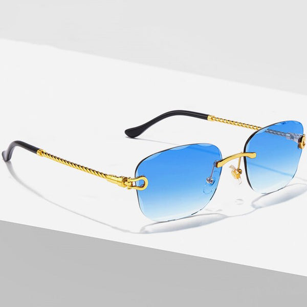 Luxe designer zonnebril met blauw gradiënt lenzen, metalen montuur, randloos, vierkant, unisex. Perfect voor modieuze mannen en vrouwen.