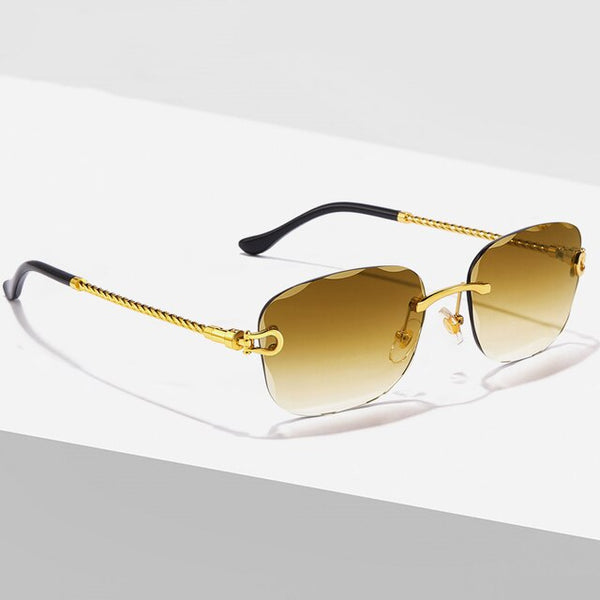 Luxe designer zonnebril met goudkleurig metalen montuur en bruine gradiënt lenzen, randloos en vierkant, unisex modeaccessoire.
