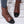 Bruine leren dameslaarzen met zwarte glanzende neuzen, vetersluiting en casual stijl. Perfect voor herfstmode en dagelijks gebruik.