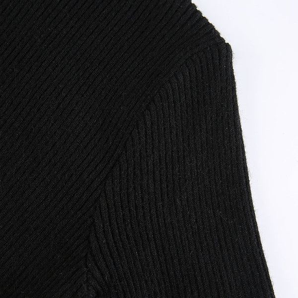 Zwarte ribgebreide jurkstof, close-up detail. Hoogwaardige textuur, modieuze kleding, comfortabele en stijlvolle damesmode.
