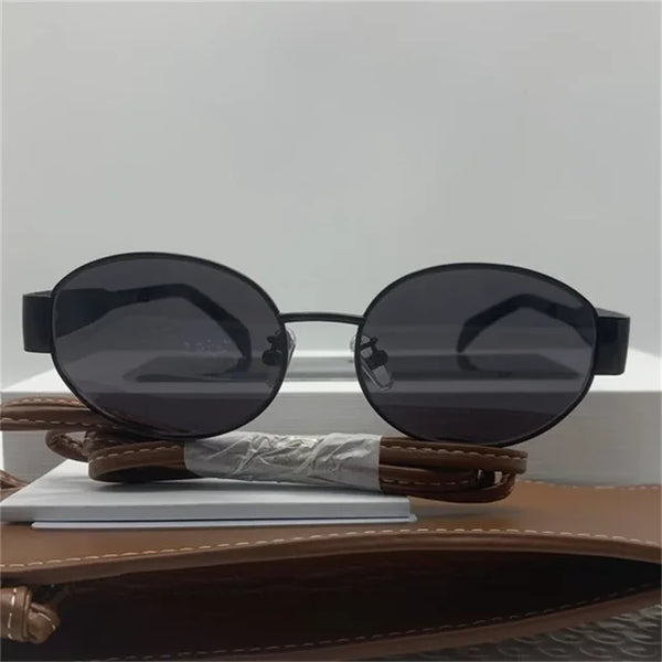 Ovale zonnebril met gouden metalen frame, unisex design, UV400 bescherming, esthetisch merk, geschikt voor zomer, modieuze accessoire.