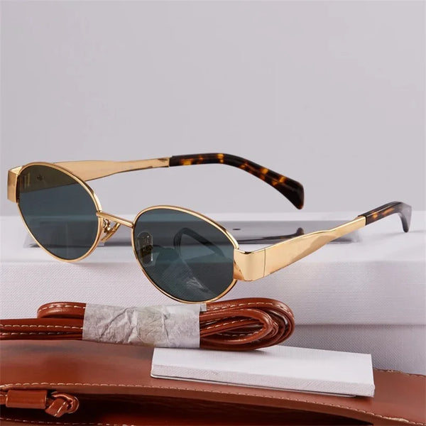 Gouden metalen ovale zonnebril met UV400 bescherming, unisex design, esthetisch merk, ideaal voor zomer, modieuze accessoire voor vrouwen.