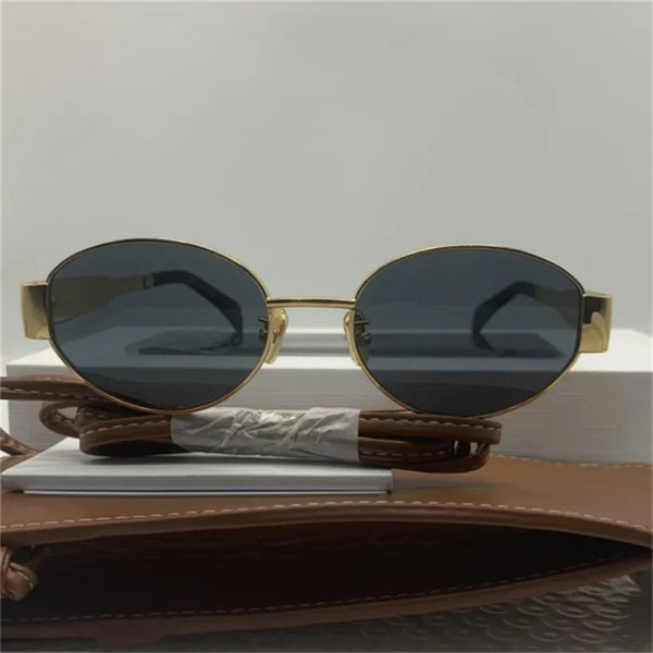 Ovale zonnebril met gouden metalen frame, unisex design, UV400 bescherming, esthetisch merk, geschikt voor zomer, modieuze accessoire.