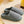 Grijze ribgebreide pantoffels op beige tapijt, comfortabele huispantoffels, warme wintermode, unisex sloffen, zachte voering, antislip zool.