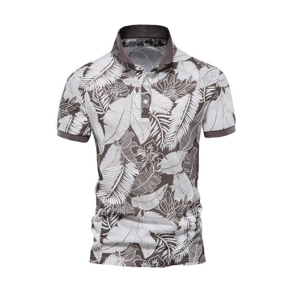 Grijze herenpolo met tropisch bladpatroon, korte mouwen en kraag. Perfect voor casual zomeroutfits. Comfortabele en stijlvolle herenkleding.