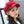 Vrouw met rode baret, modieuze dameshoed, trendy accessoire, casual stijl, herfstmode, stijlvolle outfit, moderne kleding, elegant design.