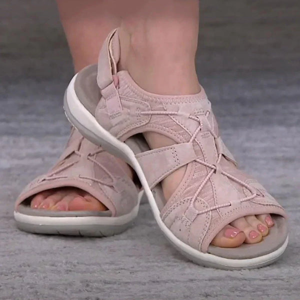 Roze dames sandalen met open teen en kruisbanden, comfortabele zool, ideaal voor zomerse wandelingen. Stijlvolle en praktische schoenen.