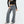 Vrouw draagt HOUZHOU Y2k wijde jeans met zijstreep en veterdetails, vintage baggy denim, trendy mode voor dames, casual en stijlvol ontwerp.