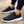 Zwarte sportschoenen voor heren met witte zool, ademend mesh materiaal, ideaal voor hardlopen en casual gebruik. Comfortabele en stijlvolle sneakers.