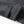 Donkergrijze wollen jas met knoopsluiting en opgerolde mouw, stijlvolle wintermode, hoogwaardige stof, close-up detail.
