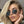 Vrouw met blonde haren draagt hippe, onregelmatige vintage zonnebril met kleine ruiten. Trendy accessoire voor dames, retro stijl.