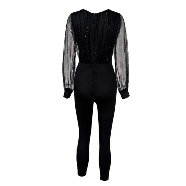 Zwarte jumpsuit met lange doorschijnende mouwen en glinsterende details, elegante avondkleding voor dames, modieuze en stijlvolle outfit.
