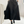 Zwarte leren midi-rok met hoge taille en brede riem, gecombineerd met zwarte enkellaarsjes. Stijlvolle damesmode, perfect voor herfst- en winteroutfits.