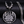 Zilveren ketting met ronde hanger, lotusgravure en maansymbolen, op zwarte achtergrond. Stijlvolle sieraden, bohemian design, spirituele betekenis.